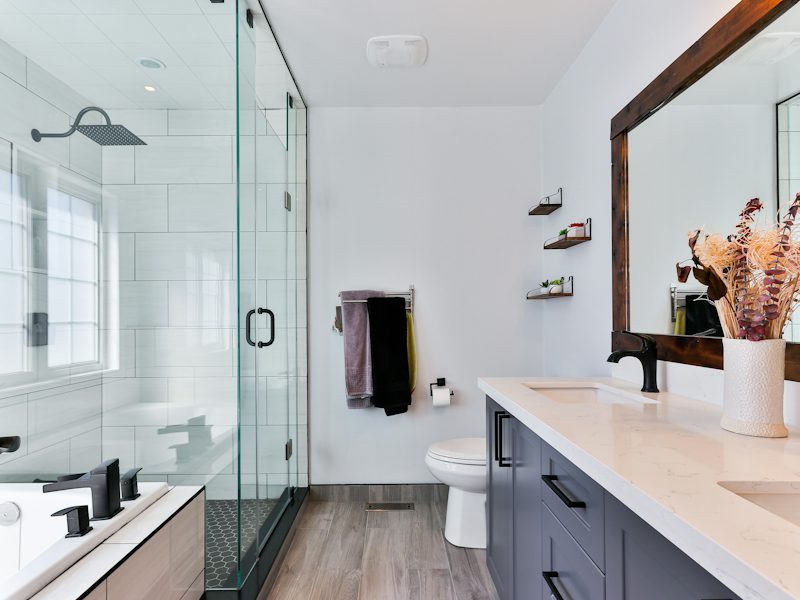 Example of a modern bathroom with a glass shower and vanity