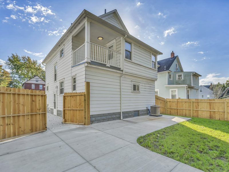 Example of a concrete walkway beside a home