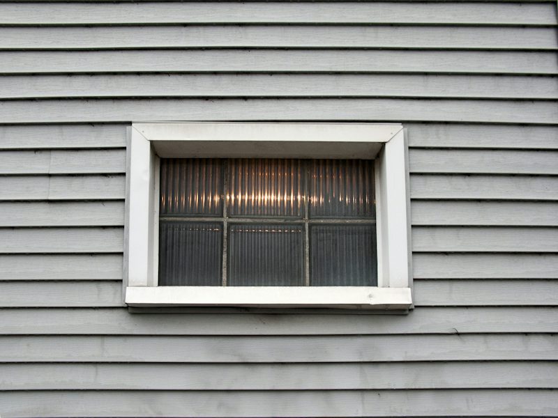 Example of gray lap siding with a trimmed window